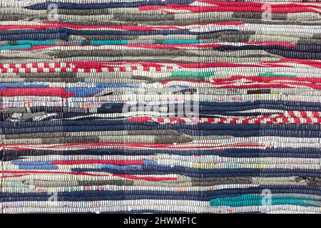 Multi striped colored textile homespun rug. Closeup. Background Stock Photo