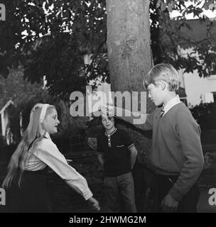Children in Hartburn, County Durham, playing conkers under a conker tree. 1971. Stock Photo