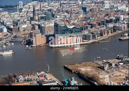 Hamburg, Germany. 05th Mar, 2022. The aerial view shows the Elbphilharmonie in the port of Hamburg. Credit: Daniel Reinhardt/dpa/Alamy Live News Stock Photo