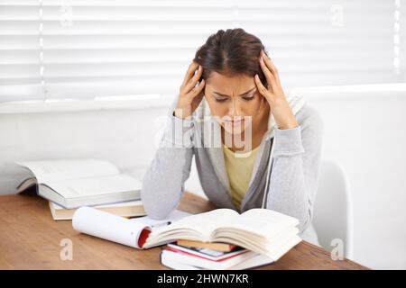 I just cant get this right. Shot of an attractive young college student battling with her studies. Stock Photo