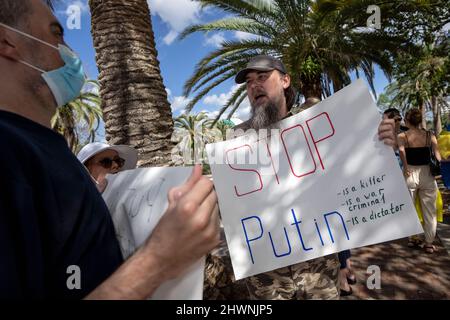 Orlando, United States. 06th Mar, 2022. Ukraine supporters holding signs during a rally in Orlando, Florida. The rally held to condemn President Vladimir Putin and Russia's invasion of Ukraine. Ukrainian President Volodymyr Zelensky called Ukrainians to fight back against the Russian invaders. Credit: SOPA Images Limited/Alamy Live News Stock Photo