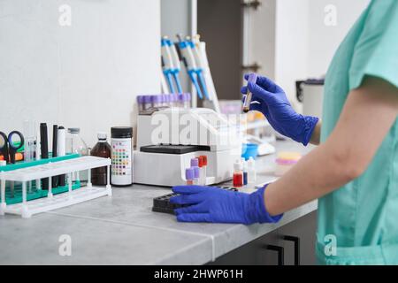 Doctor working with medical stuff in the laboratory Stock Photo
