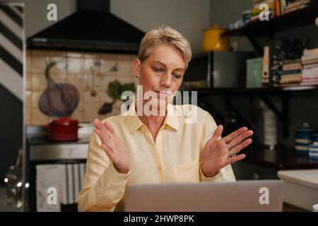 elderly business woman talking on business call Stock Photo