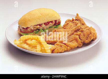 Sandwich with fried chicken and french fries Stock Photo