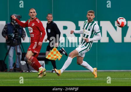 BUDAPEST, HUNGARY - MARCH 6: Lazar Cirkovic of Kisvarda Master Good  challenges Jose Marcos Marquinhos of Ferencvarosi TC during the Hungarian  OTP Bank Liga match between Ferencvarosi TC and Kisvarda Master Good at  Groupama Arena on