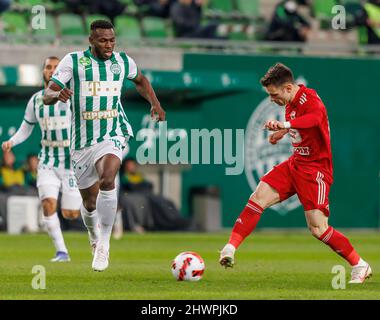 BUDAPEST, HUNGARY - MARCH 6: Claudiu Bumba of Kisvarda Master Good  challenges Henry Wingo of Ferencvarosi TC during the Hungarian OTP Bank  Liga match between Ferencvarosi TC and Kisvarda Master Good at