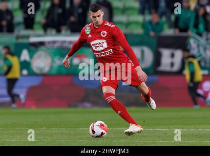 BUDAPEST, HUNGARY - MARCH 6: Lazar Cirkovic of Kisvarda Master Good  challenges Jose Marcos Marquinhos of Ferencvarosi TC during the Hungarian  OTP Bank Liga match between Ferencvarosi TC and Kisvarda Master Good at  Groupama Arena on