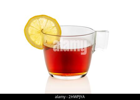 Clear glass cup of tea with lemon slice, isolated on white Stock Photo
