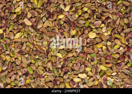 Peeled tasty pistachios isolated on  a white background. Top view. Stock Photo