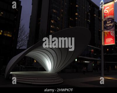 Roofed structure on Olympic Way with banner for London Designer Outlet on right, Wembley Park, London, UK. Stock Photo