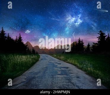 old dark night road through forest and starry sky with galaxy and planets, astronomy concept Stock Photo