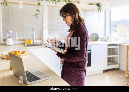 Businesswoman planning strategy working at home Stock Photo