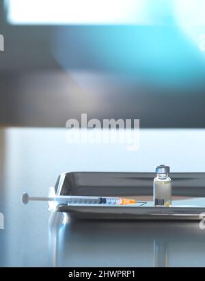 Vaccine vial with syringe in tray on desk Stock Photo