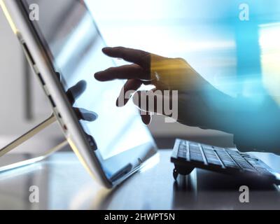 Hand of engineer touching tablet PC screen Stock Photo
