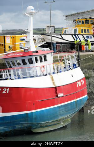 Padstow Cornwall UK fishing boats moored in the harbour - shown here PW 21 Amber Mabel at low tide Stock Photo