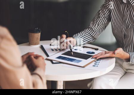 Group of Businesswoman and Accountant checking data document on paperwork chart report for investigation of corruption account Stock Photo