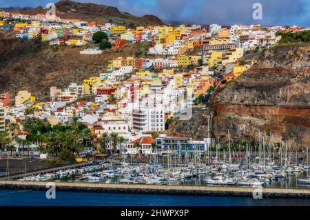 Spain, San Sebastian de La Gomera, Yachts moored in harbor of hillside town Stock Photo