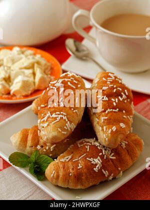 Croissants stuffed with milk chocolate. Stock Photo