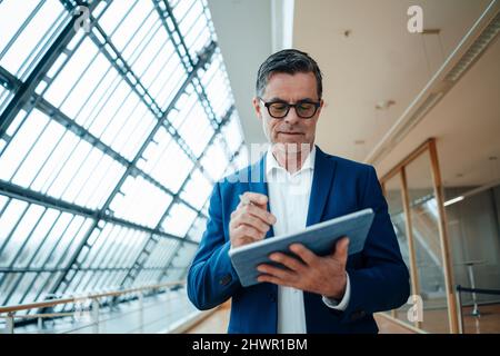 Engineer working on tablet PC at office Stock Photo