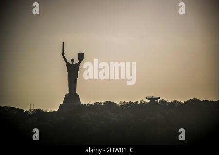 Kiev, Ukraine – October 11th, 2020: Panoramic view of Kiev with the silhouette of the Motherland Monument visible in the background Stock Photo