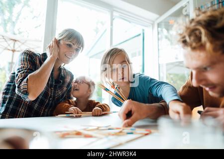 Father and son playing mikado at home Stock Photo