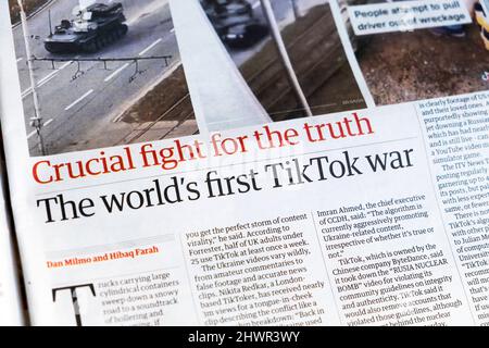 'Crucial fight for the truth The world's first TikTok war' Russia Ukraine videos article in Guardian newspaper headline 5 March 2022 London England UK Stock Photo