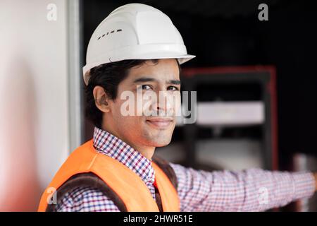 Portrait of confident engineer wearing hardhat Stock Photo