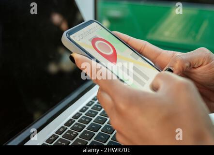 Businesswoman using GPS navigation app on smart phone Stock Photo