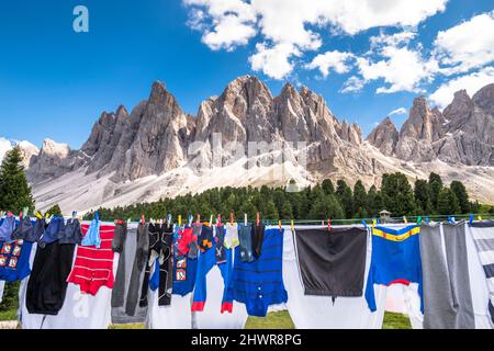Italy, South Tyrol, Geislergruppe range in summer with laundry drying in foreground Stock Photo