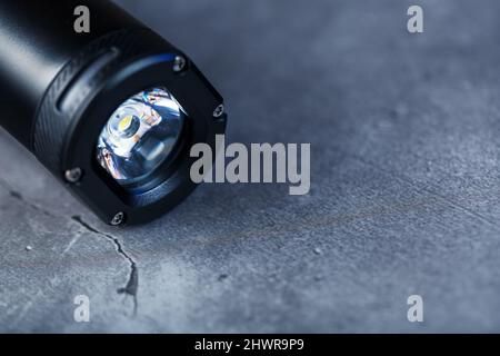 Led black lantern close-up on gray textured background, free space Stock Photo