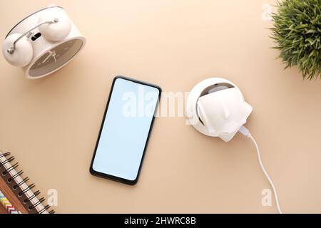 smart phone and CCTV security camera on table  Stock Photo