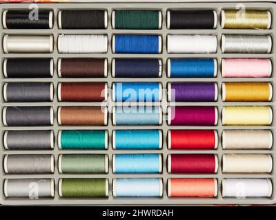 Assortment of spools with colored sewing thread Stock Photo