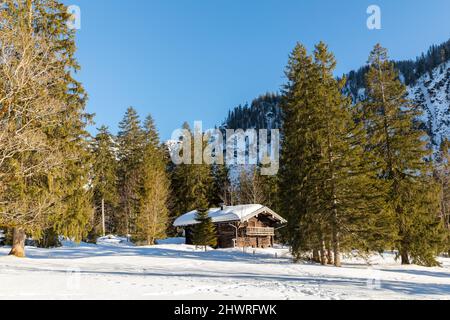 Hut at frozen lake Loedensee near Ruhpolding, Bavaria, Germany Stock Photo