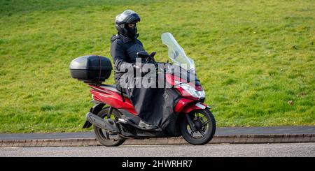 Honda PCX Scooter with rider using Tucano Bar muffs and leg cover Stock Photo Alamy