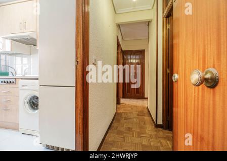 Entrance to a house with distributor hall with doors to kitchen, bathroom and bedrooms Stock Photo