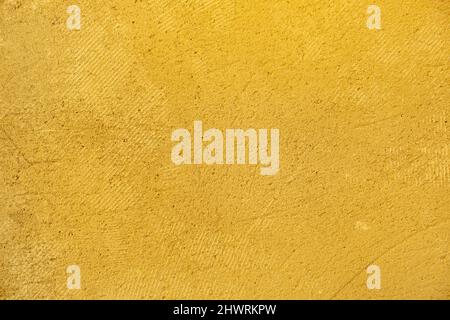 Rough Yellow plaster. Textured wall background Stock Photo