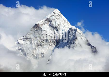 Mount Ama Dablam within clouds, way to Everest base camp, Khumbu valley, Solukhumbu Sagarmatha national park, Everest area, nepalese himalayas, Nepal Stock Photo