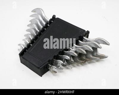 an old tool set of stainless steel spanners in a black box isolated in a white background Stock Photo