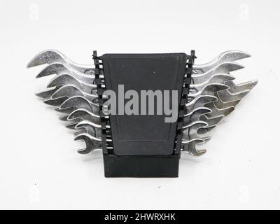 an old tool set of stainless steel spanners in a black box isolated in a white background Stock Photo