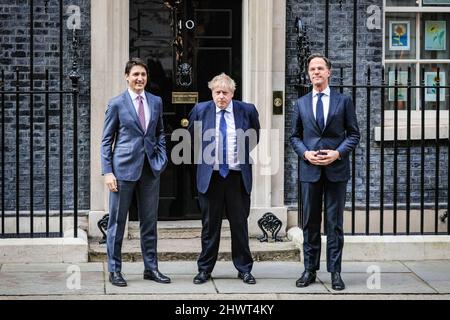 London, UK. 07th Mar, 2022. Justin Trudeau arrives and is welcomed by Boris Johnson. Mark Rutte arrives and is welcomed by Boris Johnson. British Prime Minister Boris Johnson greets first Dutch PM Mark Rutte, then Canadian Premier Justin Trudeau, and meets with both at 10 Downing Street before all three pose for a photo and leave for a press conference. Credit: Imageplotter/Alamy Live News Stock Photo