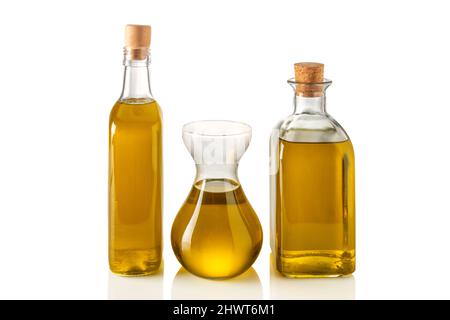 Bottles and decanter of extra virgin olive oil isolated on white, clipping path Stock Photo