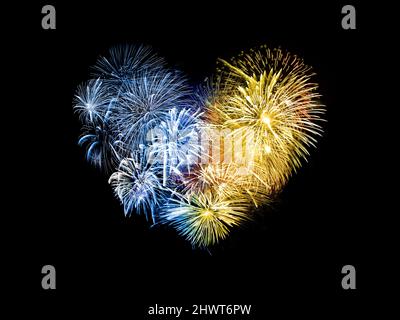 Blue and yellow firework in the shape of a heart,  help and love for Ukraine concept Stock Photo