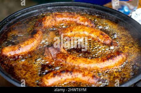 deep fried hungarian sausages in a pan on an festival in Lukacshaza Hungary Stock Photo