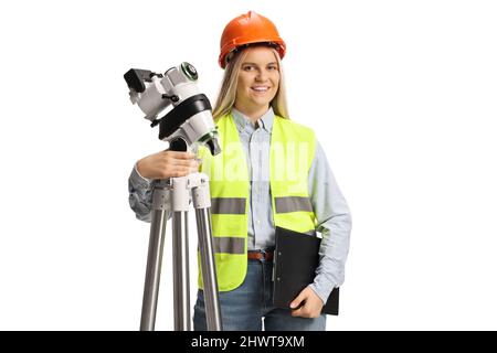 Female geodetic surveyor posing with a measuring equipment isolated on white background Stock Photo