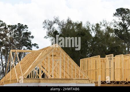 Angled roof ridge area of a new construction house being built Stock Photo