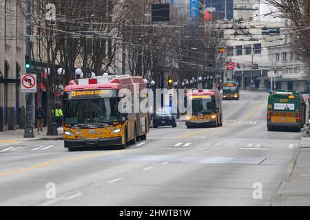 Seattle, WA, USA - March 06, 2022; Buses in downtown Seattle on the dedicated 3rd Avenue bus street Stock Photo