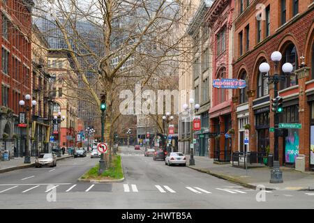 Seattle, WA, USA - March 06, 2022; 1st Avenue South in the Pioneer Square neighborhood of Seattle with the historic Stete Rooms 75 cents sign Stock Photo