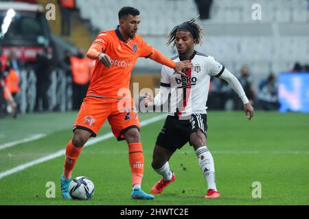 ISTANBUL, TURKEY - MARCH 7: Trezeguet of Istanbul Basaksehir FK and Valentin Rosier of Besiktas JK battle for possession during the Turkish Super Lig match between Besiktas JK and Istanbul Basaksehir FK at Vodafone Park on March 7, 2022 in Istanbul, Turkey (Photo by Orange Pictures) Stock Photo