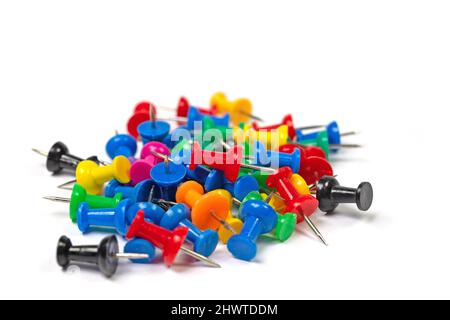 Colorful pushpins against a white background Stock Photo