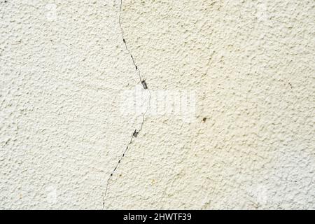 surface of concrete gray wall  in cracks Stock Photo